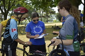 Volunteer Hannah McGregor helping tour participants on Pedalling the Parks, August 7, 2022. Image by Agnes Manivit.