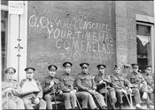 War-wounded soldiers in World War I appear with graffiti near Yonge and College streets. Courtesy of the City of Toronto Archives.