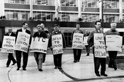 Strikers picket at TTC headquarters on April 30,
1964.