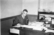 Arthur Taylor working at his desk, circa 1942.