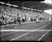 Olympic runner Harry Jerome races at Exhibition Stadium, circa 1960.