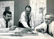 Left to right: Developer John H. Daniels, planner Eli Comay, and architect/planner James A. Murray with plans for Erin Mills, 1968. Courtesy of Joan Bosworth and the Murray family.